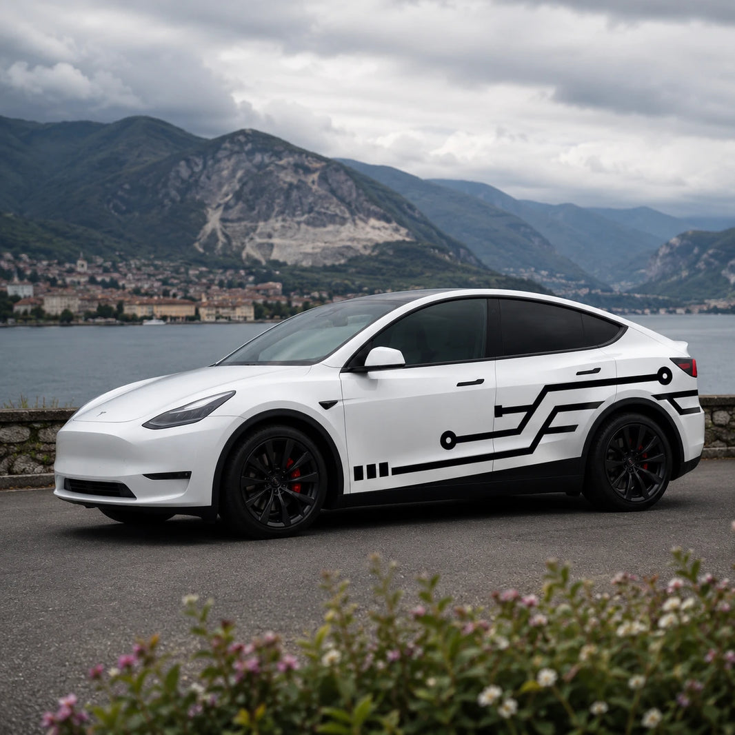 Tesla Model Y circuit board tech geometric side wrap decal front three-quarter view Italian alpine lake cloudy mountain background