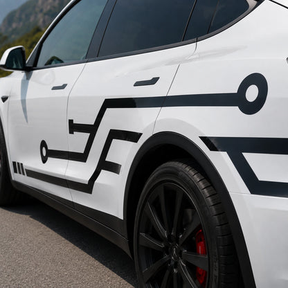 Tesla Model Y circuit board side decal close-up door panel black geometric PCB line node angular trace detail rocky mountain background