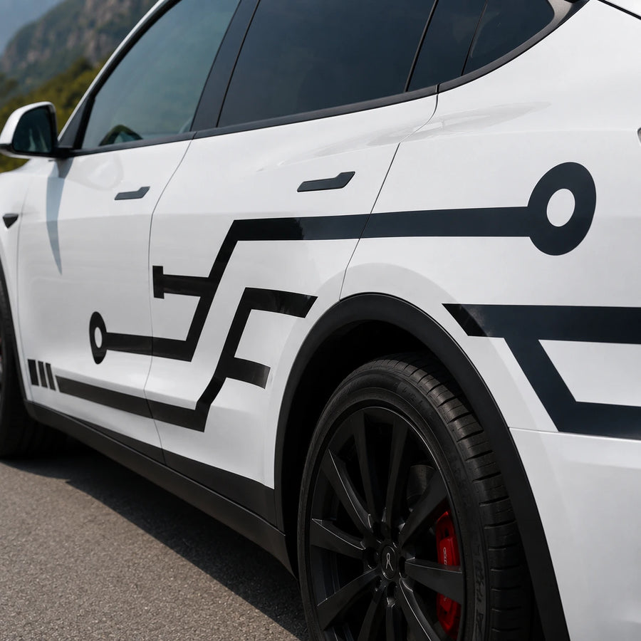 Tesla Model Y circuit board side decal close-up door panel black geometric PCB line node angular trace detail rocky mountain background