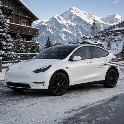 Tesla Model Y patriotic distressed American flag side decal front three-quarter view snowy alpine village mountain winter background