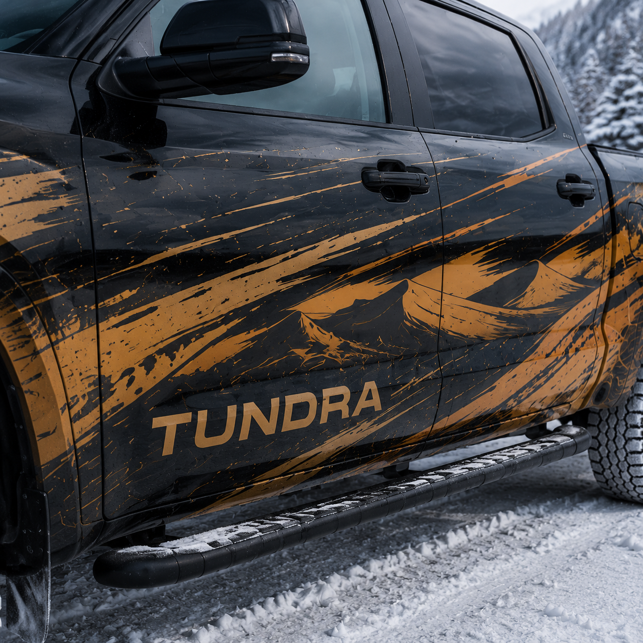 Close-up of orange and black brush stroke racing decal on Toyota Tundra door panel with TUNDRA lettering in snow setting