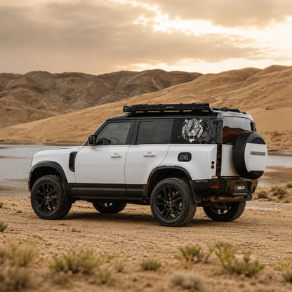 White Tiger rear window vinyl decal on white Land Rover Defender full side view desert sunset background